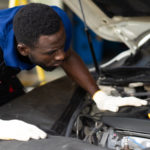 Technician Inspecting Car