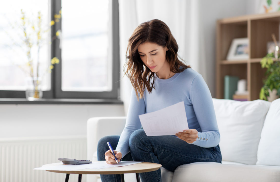 Woman Calculating Lease Write-Off