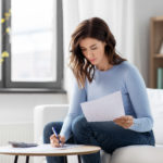 Woman Calculating Lease Write-Off