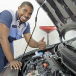 Technician inspecting engine