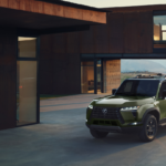 Drab green Lexus GX SUV parked at a home